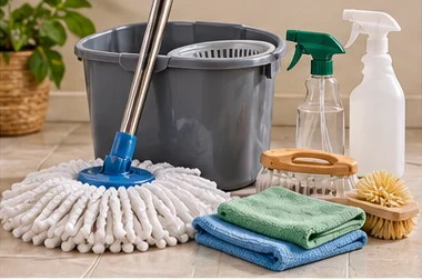 Mop, bucket, brushes, cloths and spray bottles